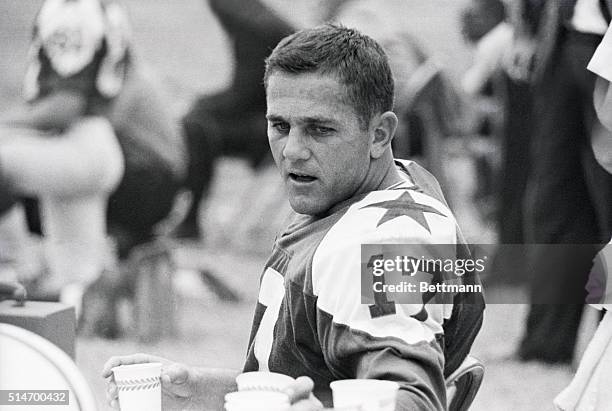 Quarterback Don Meridith of the Dallas Cowboys drinks water on the sidelines during a 1963 game against the Philadelphia Eagles.