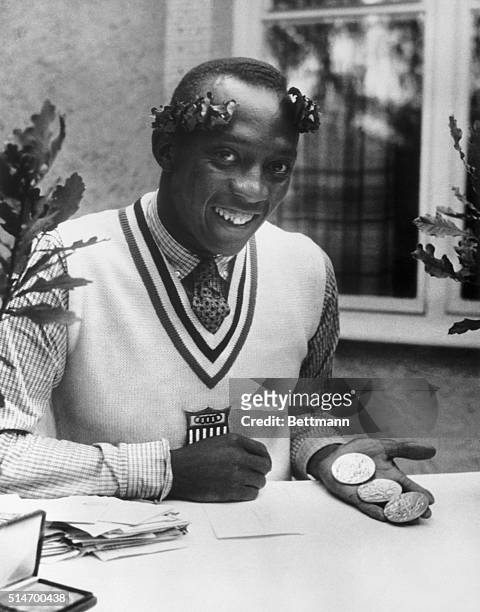 Berlin,Germany. Wearing his Olympic laurel wreath, a big smile and an invisible rainbow around his shoulder, Jesse Owens,U.S. Miracle man of the...