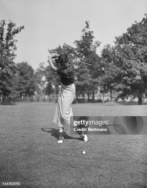 Chicago, IL: Marion Miley, Woman Champion golfer in mid-swing. She recently made golf history by winning the Women's Western Derby for the third...