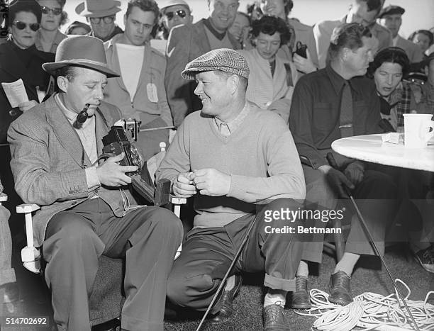 Pebble Beach, CA: Singer Bing Crosby makes a film record of confident Byron Nelson before a round of the $10,000 Bing Crosby golf tournament at...