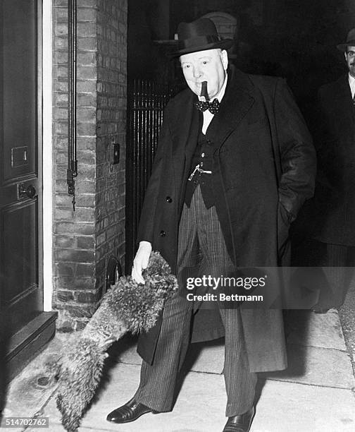 London, England: Winston Churchill is greeted at the door of his London home by Rufus, his two-year-old miniature red poodle. Rufus wants to hear all...