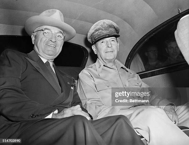 President Truman and General MacArthur sitting together in back seat of car at Wake Islands.