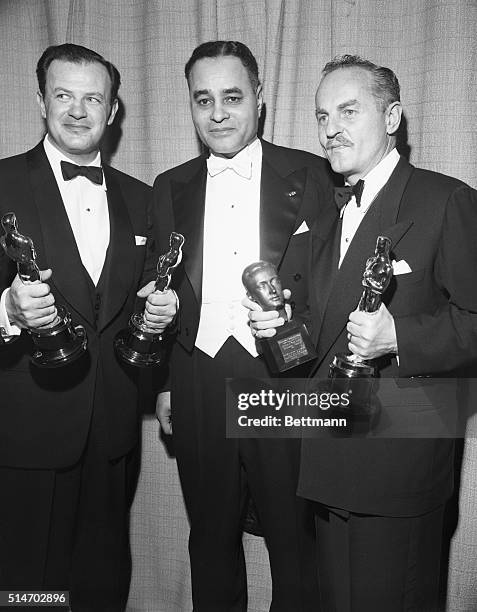 Hollywood, California: Joseph L. Mankiewicz holds the "Oscars" awarded to him for the Best Direction and Best Screenplay at the 23rd Annual Academy...