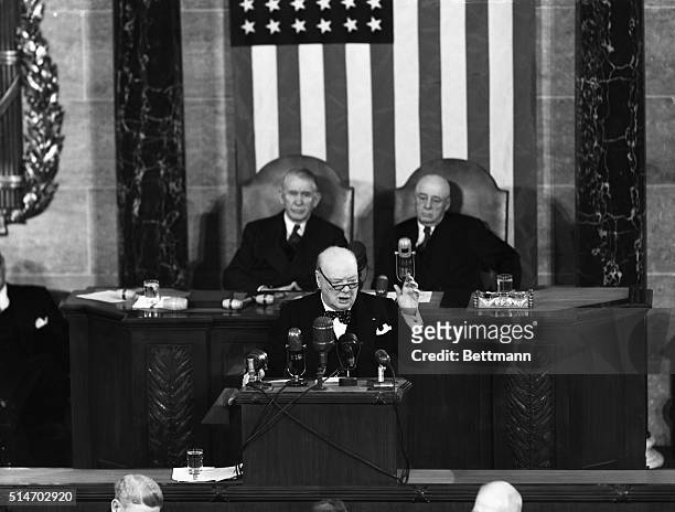 Washington, DC: British Prime Minister Winston Churchill addresses a joint session of the U.S. Congress. Behind him are Vice President Alben Barkley...
