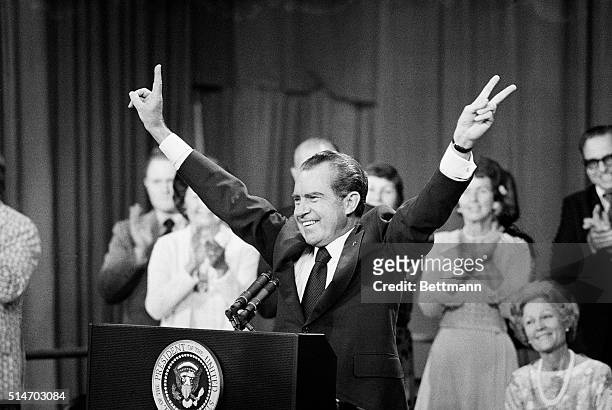 President Richard Nixon gives the "V" sign to an audience at the Phoenix Coliseum before a speech.