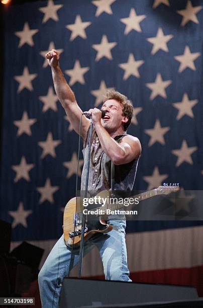 Rock musician Bruce Springsteen belts out his hit song "Born in the USA" before a sellout crowd as he kicks off his US tour in Washington, DC.