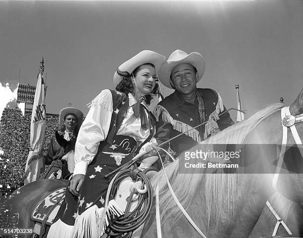 Hollywood, CA: Dale Evans and her favorite cowboy, husband Roy Rogers, enjoyed their reception when they appeared at a Los Angeles Rodeo. Photo shows...