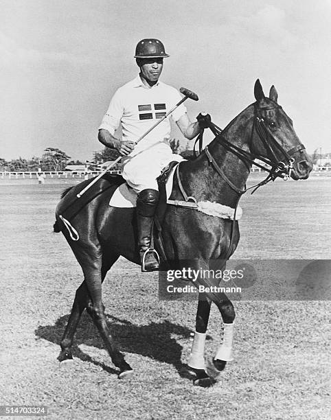 Ciudad Trujillo, Dominican Republic: Profirio Rubirosa, husband of heiress Barbara Hutton, is shown in polo togs on the field at Ciudad Trujillo,...