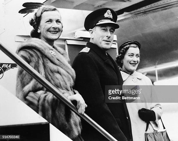 London, England: Home to head the admiralty. Britain's new first Lord of the Admiralty, Lord Mountbatten, arrives at London Airport after a farewell...