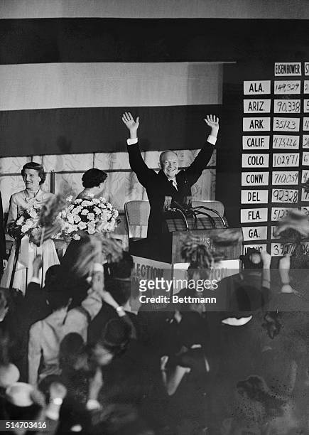 Washington, DC: President Eisenhower acknowledges the applause of fellow Republicans gathered at a gala GOP victory celebration in the Sheraton Park...