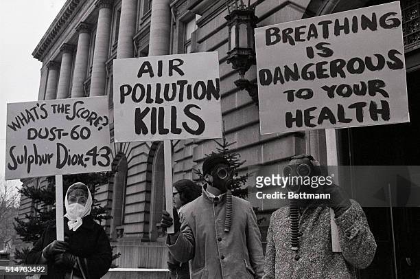 Cleveland, Ohio: Protesting Cleveland's dirty air these people donned gas and face mask in front of City Hall as a citizens revolt against dirty air...