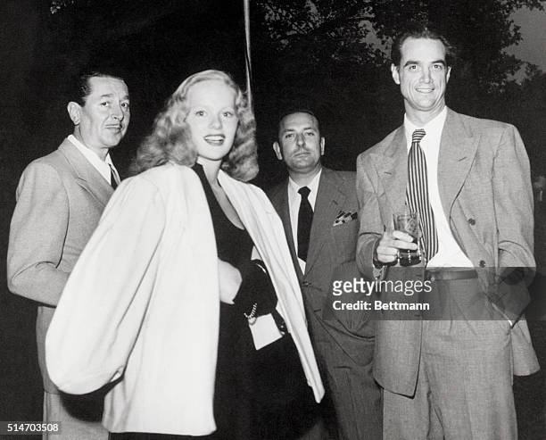 HOWARD HUGHES, AVIATION ENTHUSIAST AND MOVIE PRODUCER WITH ACTRESS PEGGY CUMMINS AND COMPANY. FILED 1/1/69