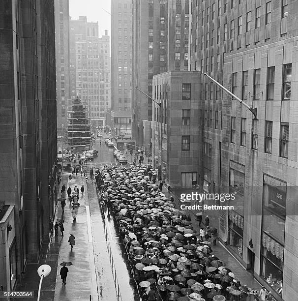 The rains came and so did the crowds, lined up completely around the block to see the Radio City Music Hall's Great Christmas show "A Boy Named...