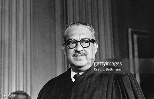 Thurgood Marshall, the great-grandson of a slave, takes his seat as the first black member of the United States Supreme Court.