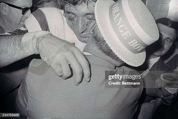 Miami, FLA.: An ecstatic Joe Namath gets a happy hug from his father, John, in the locker room after Namath quarterbacked the AFL New York Jets to...