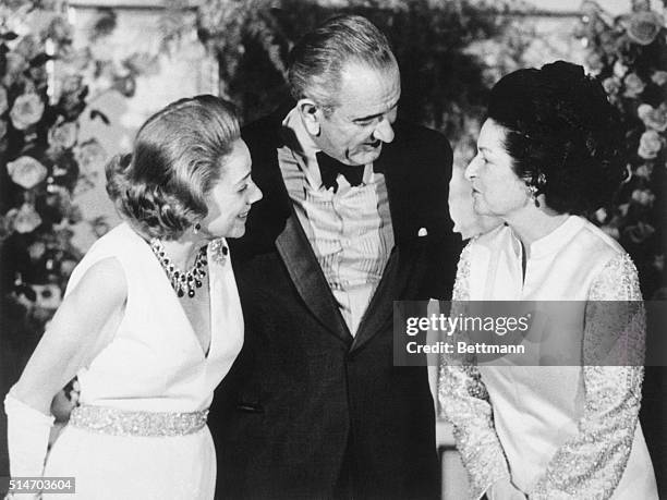 President and Lady Bird Johnson talk with Brooke Astor at the Plaza Hotel in New York.