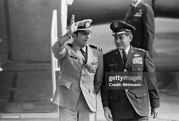 Travis AFB, Calif.: Lt. Cdmr Everett Alvarez, Jr , USN, is escorted by Maj. Gen. John F. Gonge, CG, 22d Air Force, Mac. Alvarez, from Santa Clara,...