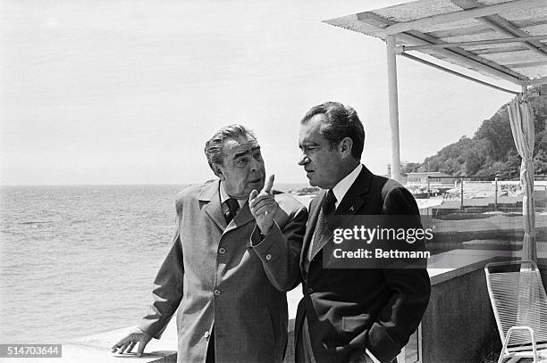 Yalta, U.S.S.R: Standing on the shore of the Black Sea Soviet Party Leader Leonid Brezhnev makes a point to President Nixon as the two world leaders...