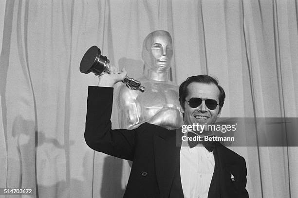 Actor Jack Nicholson waves his Oscar which he received for best actor in the film One Flew Over the Cuckoo's Nest at the 48th Annual Academy Awards.