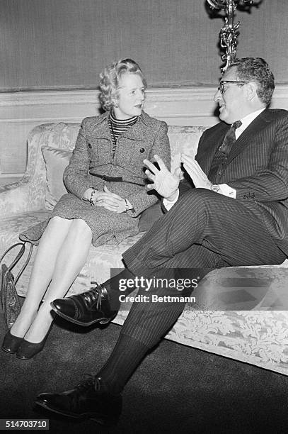 Secretary of State Henry Kissinger talks with British Opposition leader Margaret Thatcher at the Claridges Hotel in London. | Location: Claridges...