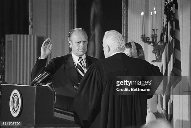 Washington, DC: Gerald R. Ford takes the oath of office as the 38th President of the United States. Chief Justice Warren Burger administers the oath,...