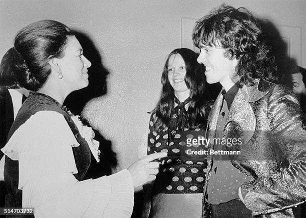 London: Princess Margaret talks with singer Donovan at "pop" concert she attended at the Odeon Hammersmith, Dec 6. In center is Donovan's wife,...