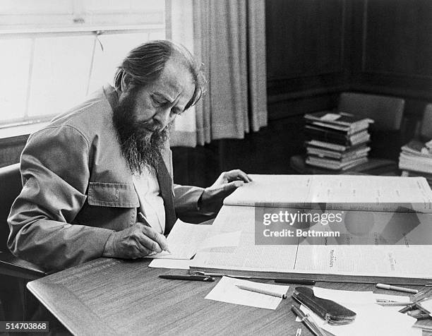 Soviet author Alexandr Solzhenitsyn, takes notes at Stanford University's Hoover Tower library. He won the Nobel Prize for Literature for his...
