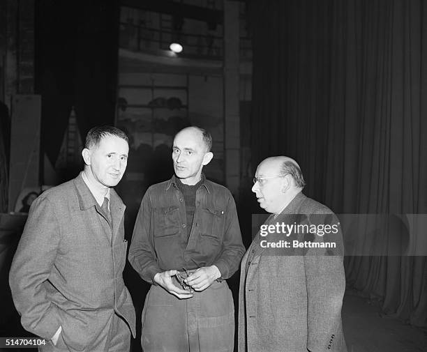 Berlin, Germany: Playwright Bert Brecht and Hans Eisler musician who was ejected from the US for Communist leanings, chat, with unidentified...