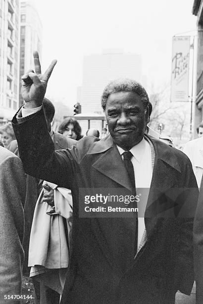United States Representative Harold Washington waves a victory sign after voting in the primary election in which he is a candidate for the office of...