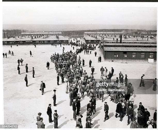 Buchenwald, Germany: U.S. Third Army troops march into Buchenwald concentration camp near Weimar, Germany, after its liberation. In this camp, since...