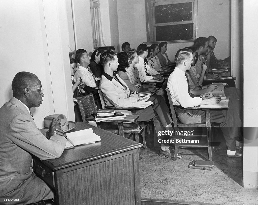 African American Student Sits Outside of Classroom