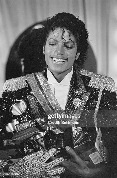 Los Angeles: Superstar Michael Jackson holds several Grammy Awards he won at the Shrine Auditorium here 2/28. His top award was the Album of the...