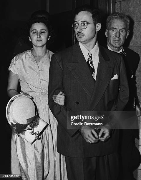 Julius and Ethel Rosenberg leave federal court after being indicted on charges of espionage in the Klaus Fuchs atomic spy ring