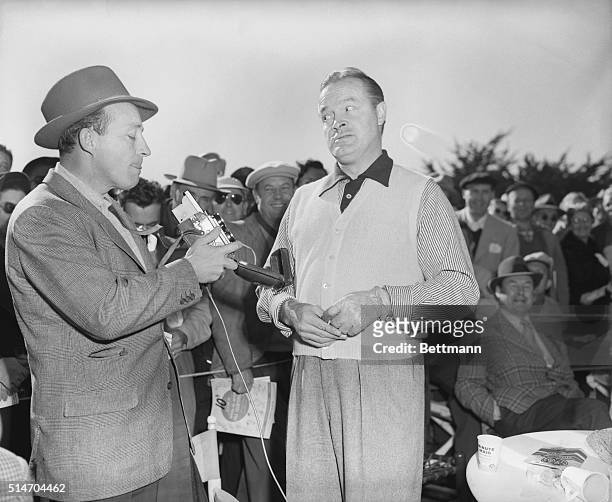 Pebble Beach, CA: Bing Crosby takes Bob Hope's picture at the 1st green before Bob took time to tee off in the $10,000 National pro-amateur tourney....