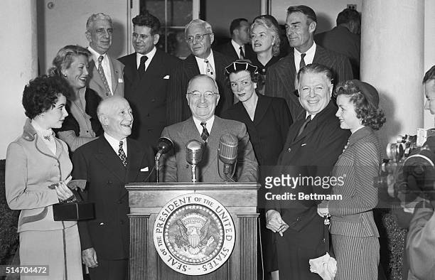 Washington, DC: President Truman greets motion picture industry representatives in connection with the 50th anniversary of the American Movie...