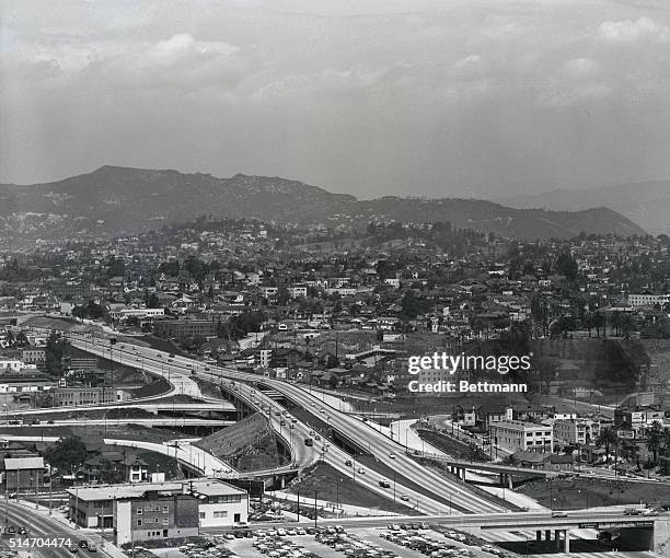 May 1952-CA: Looking North from atop City Hall, roadways seen in foreground is junction point for the Hollywood, Santa Ana, Pasadena and Harbor...