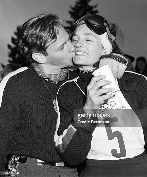 Oslo, Norway: Skier-husband Dave gives his wife Andrea Mead-Lawrence a victory kiss following her win in the women's slalom ski race at Rodkleiv on...