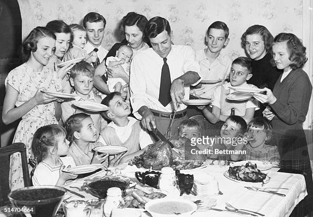 Joliet, ILL: Early Thanksgiving dinner for large family. The Raymond Baker Family of 18 members decided to celebrate Thanksgiving early so that Mrs....