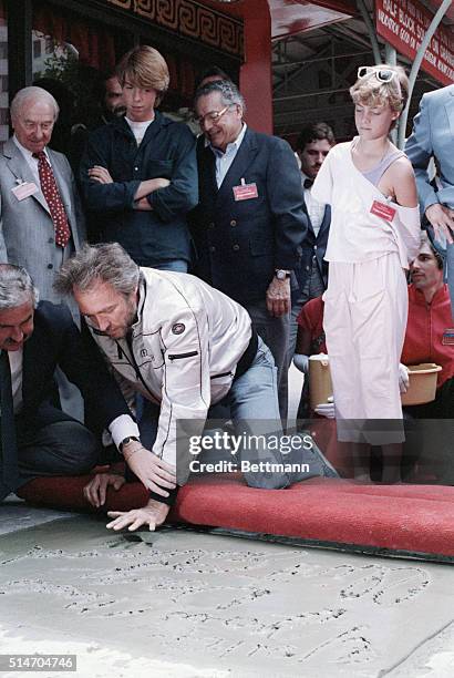 Clint Eastwood had his hands and footprints put in cement at Mann's Chinese Theater in Hollywood, CA. With him are his children Kyle and Alison.