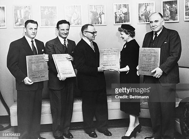 New York, NY: Shirley Booth accepts her award as "Best Actress of the Year" for her role in "Come Back Little Sheba" from Leo Mishkin, Chairman of...