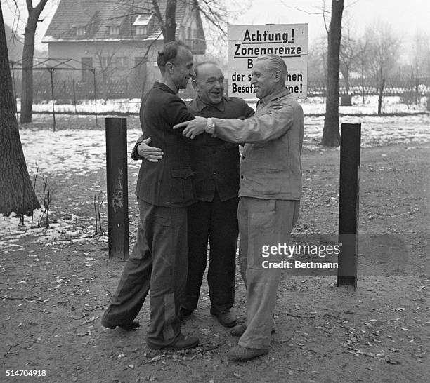 Berlin Germany: Embracing joyfully upon their arrival in West Berlin are three Germans, who made a daring escape fom a communist camp. Authorities...