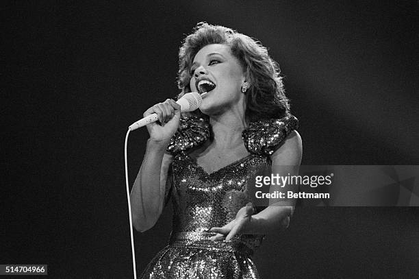 Miss New York Vanessa Williams sings during the talent portion of the 1984 Miss America pageant in Atlantic City. Williams won the pageant, only to...