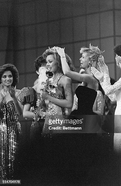 Miss America 1983 Debra Maffett crowns Vanessa Williams as Miss America 1984 at the pageant in Atlantic City. Williams was the first African American...