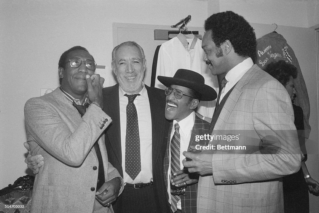 Bill Cosby and Sammy Davis, Jr are visited by Anthony Quinn and