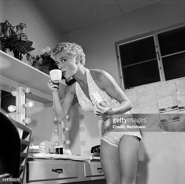 Las Vegas, NV: Boisterous Betty Hutton sips tea in her dressing room after announcing to the crowd at the Desert Inn Hotel that she can't take "the...