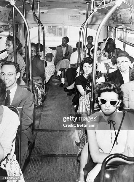Despite a court ruling on desegregating buses, white and blacks continue to be divided by their own choice.