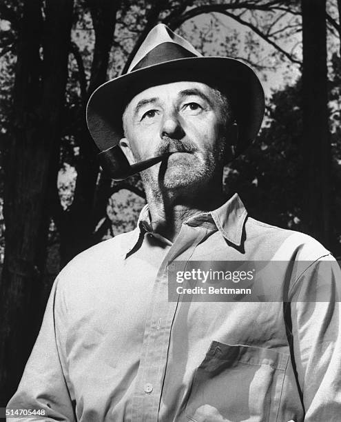 Oxford, MS: William Faulkner with pipe and hat. Despite all his fame and fortune he lives the quiet life of a country squire at Oxford, where his...