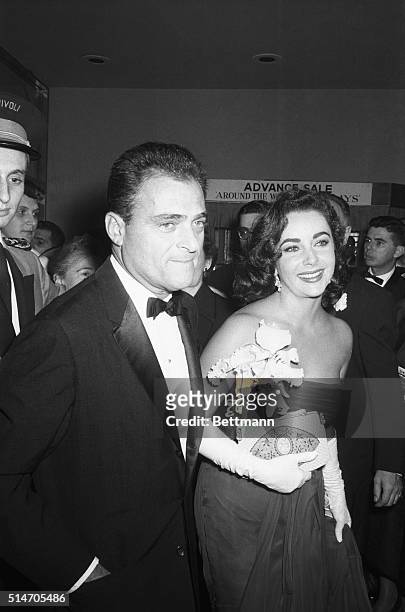 New York, NY: Linked romantically in Hollywood, actress Elizabeth Taylor and producer Michael Todd arrive at the premiere of Todd's new movie "Around...