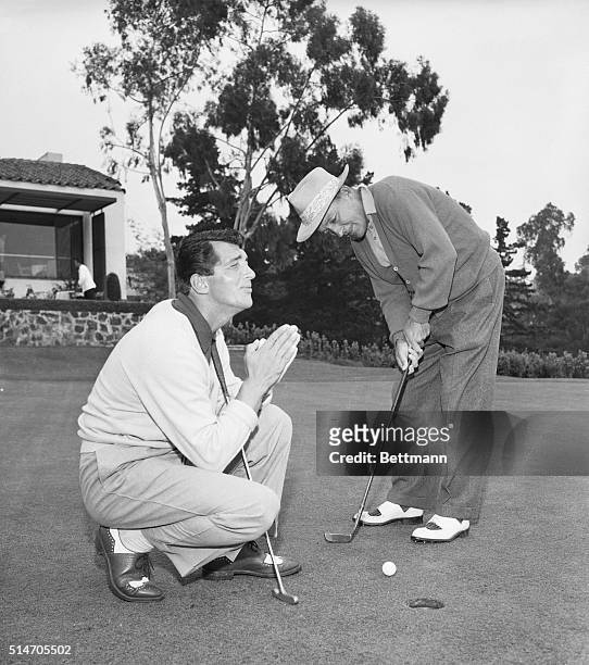Bel Air, CA: Dean Martin and Bing Crosby do a little cutting up as the pair take part in the second annual Bel Air Country Club Invitaional...