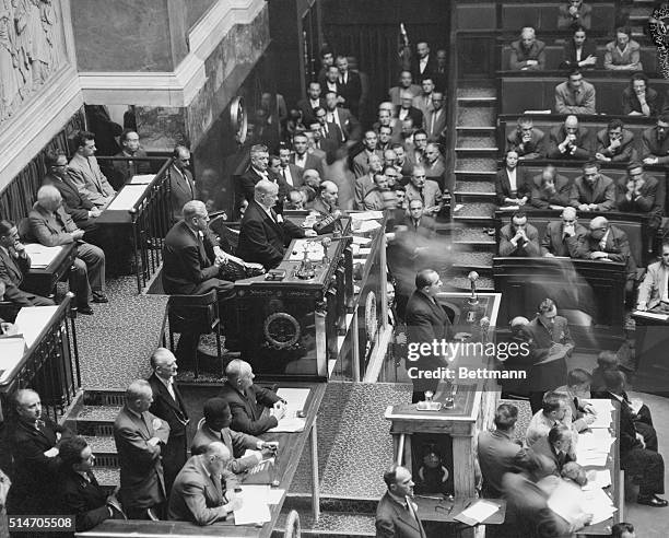 Paris, France: Premier Pierre Mendes-France addresses the French National Assembly July 22nd, a few hours after his return from Geneva, where he...